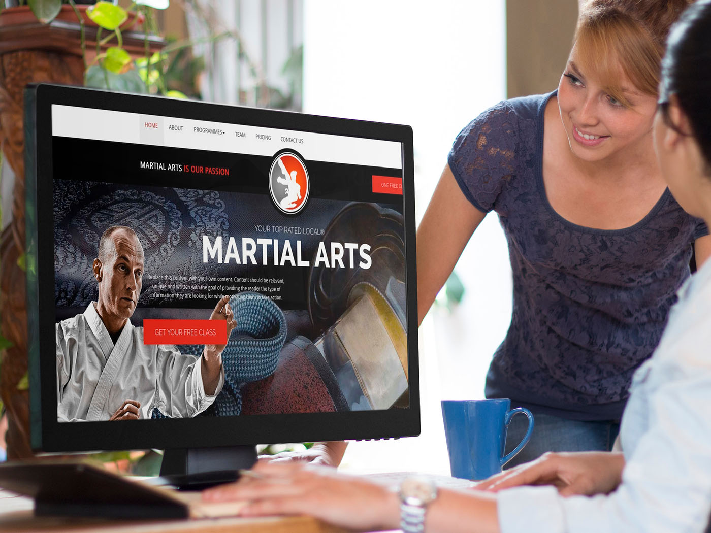 Women looking at martial arts website.